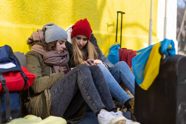 The Ukrainian immigrants crossing border and sitting and waiting for registration. - HPIF01395