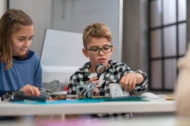 Pupils at school working with electronics component at a robotics classroom. - HPIF02324