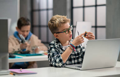 Pupils at school working with electronics component at a robotics classroom. - HPIF02327