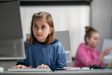 School kids using computer in a classroom at school - HPIF02330