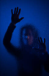 The shadow of woman screaming behind the glass, domestic violence concept. - HPIF02725