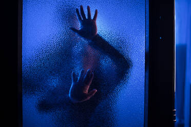 The shadow of woman screaming behind the glass, domestic violence concept. - HPIF02728