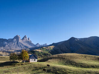 Scenic view of mountains and field under blue sky at Vanoise national park, France - LAF02778