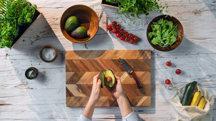 A top view of unrecognizable woman preparing vegetable salad, sustainable lifestyle. - HPIF03088