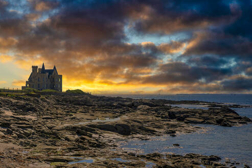 France, Brittany, Quiberon, Dramatic clouds over Chateau Turpault at dusk - FRF01003