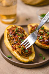 Tray of ready to eat stuffed potatoes with smoked meat and chive - FLMF00881