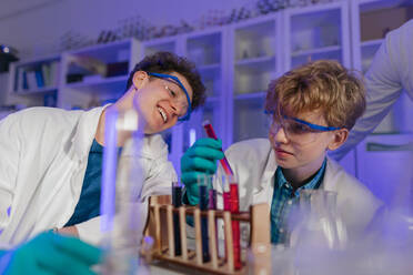 A science student doing chemical experiment in the laboratory at university. - HPIF03491