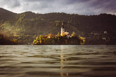 Slovenia, Bled, View of Bled Island at autumn dusk - FCF02120