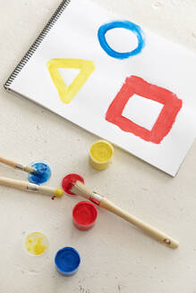 Colorful geometric shapes painted in note pad - MEGF00359