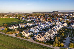 Germany, Baden-Wurttemberg, Waiblingen, Aerial view of suburban houses in new modern development area - WDF07203