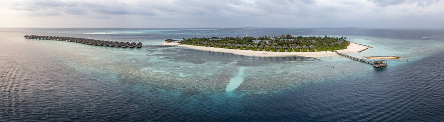 Resort bungalows on turquoise Indian ocean, Maldives - AMF09729