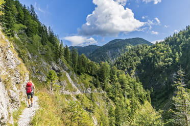 Germany, Bavaria, Female hiker walking through Rappinschlucht to Rabenkopf - FOF13248