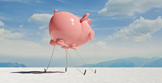 Three dimensional render of floating piggy bank tied down to ground in desert - VTF00666