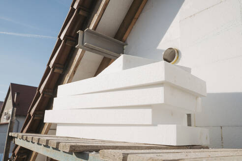 Stack of polystyrene foam kept by wall - OSF01268