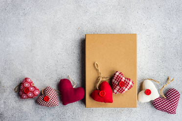 Rustic gift box with textile hearts as a present for Valentine's Day - ADSF42192