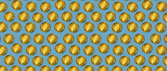 Many golden coins with symbol of Ethereum cryptocurrency forming seamless pattern on blue background - ADSF42463