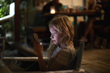 Girl using smartphone at night - FOLF11996