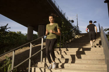 Young woman jogging on steps - FOLF12119