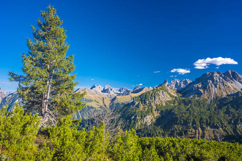 Scenic view of mountain ranges under blue sky - MHF00696