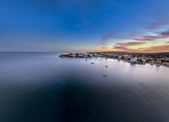 Spain, Balearic Islands, Santa Ponsa, Mallorca, Aerial view of seaside town at dusk - AMF09753