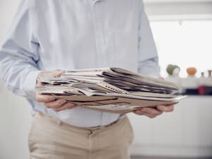 Close up of man holding waste paper - PWF00520