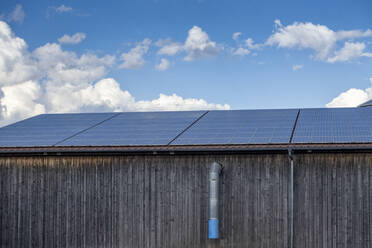 Germany, Bavaria, Augsburg, Solar panels on rural building - MAMF02363