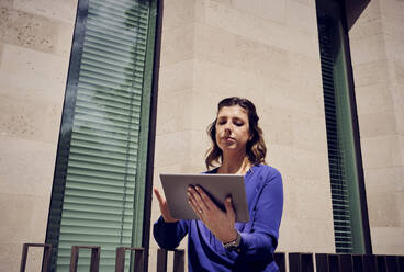 Young businesswoman using tablet computer on sunny day - PWF00583