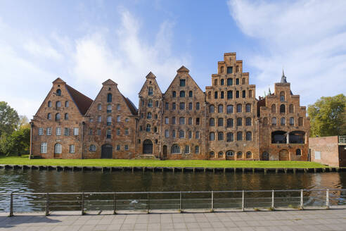 Germany, Schleswig-Holstein, Lubeck, Historic warehouses on bank of river Trave - WIF04684