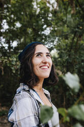 Thoughtful young woman at park - MRRF02568