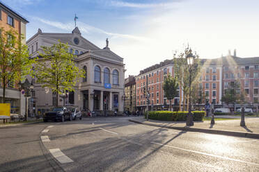 Germany, Bavaria, Munich, Gartnerplatztheater opera house and Gartnerplatz square at sunset - MAMF02480