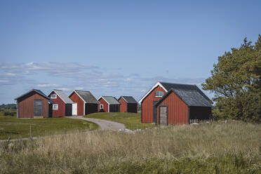 Sweden, Oland, Kapelludden, Red fishing huts - KEBF02579