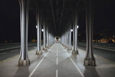 France, Ile-de-France, Paris, Underside of Pont de Bir-Hakeim at night - MMPF00633