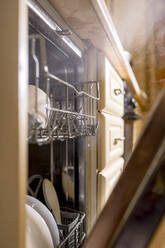 Utensils in rack of dishwasher at home - ANAF00896