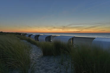 Netherlands, Zeeland, Groede, Beach huts at dusk - FDF00348
