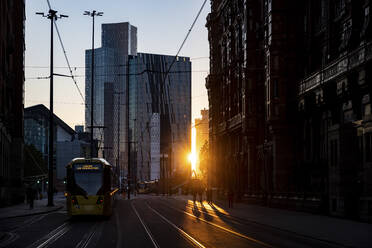 UK, England, Manchester, Downtown street at sunset - WPEF06921