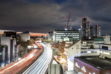 UK, England, Manchester, Long exposure of city traffic at night - WPEF06925