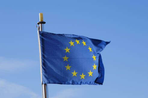 European Union flag fluttering against sky - WIF04689