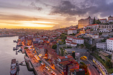 View of Douro River and The Ribeira district from Dom Luis I bridge at sunset, UNESCO World Heritage Site, Porto, Norte, Portugal, Europe - RHPLF23413