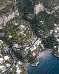 Aerial view of a scenic road in Positano on the Amalfi Coast drive, Salerno, Campania, Italy. - AAEF17196