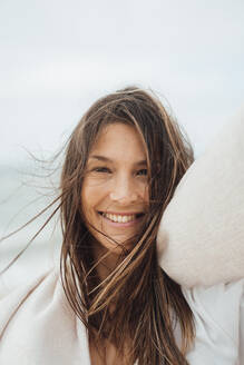 Happy brunette woman with long hair - JOSEF16201