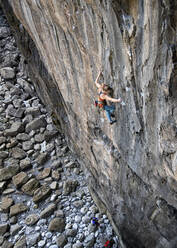 Active woman climbing on rocky wall - ALRF01910