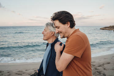 Happy father and son spending time together on beach - JOSEF16491