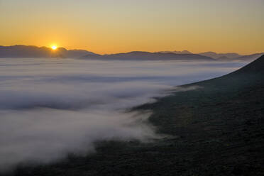 Scenic view of mountains with fog at sunrise - LBF03720