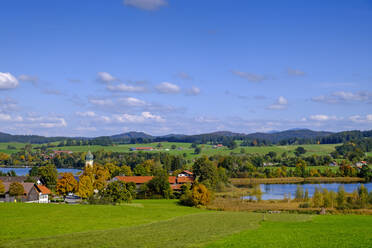 Germany, Bavaria, Riegsee, Village on shore of Riegsee lake in sunshine - LBF03729