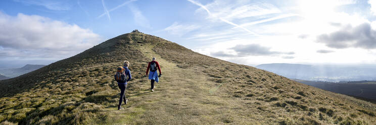 Mother and son hiking on mountain, Sugar Loaf, Brecon Beacons, Wales - ALRF01969