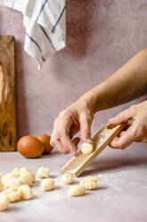 Hands of woman making gnocchi - FLMF00891