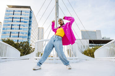 Young dancer breakdancing on bridge - OIPF03131