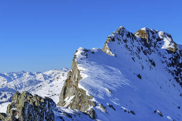 Austria, Tyrol, Snowcapped peak of Innerer Falk mountain - ANSF00232