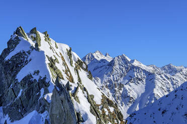 Austria, Tyrol, Snowcapped peak of Innerer Falk mountain - ANSF00236