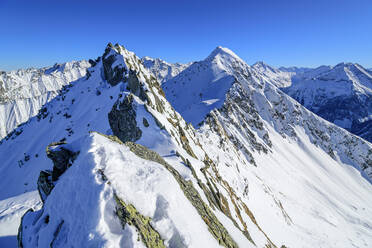 Austria, Tyrol, Snowcapped peak of Innerer Falk mountain - ANSF00237